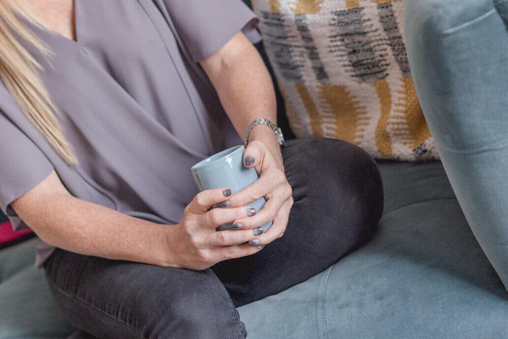 lady with hands round mug