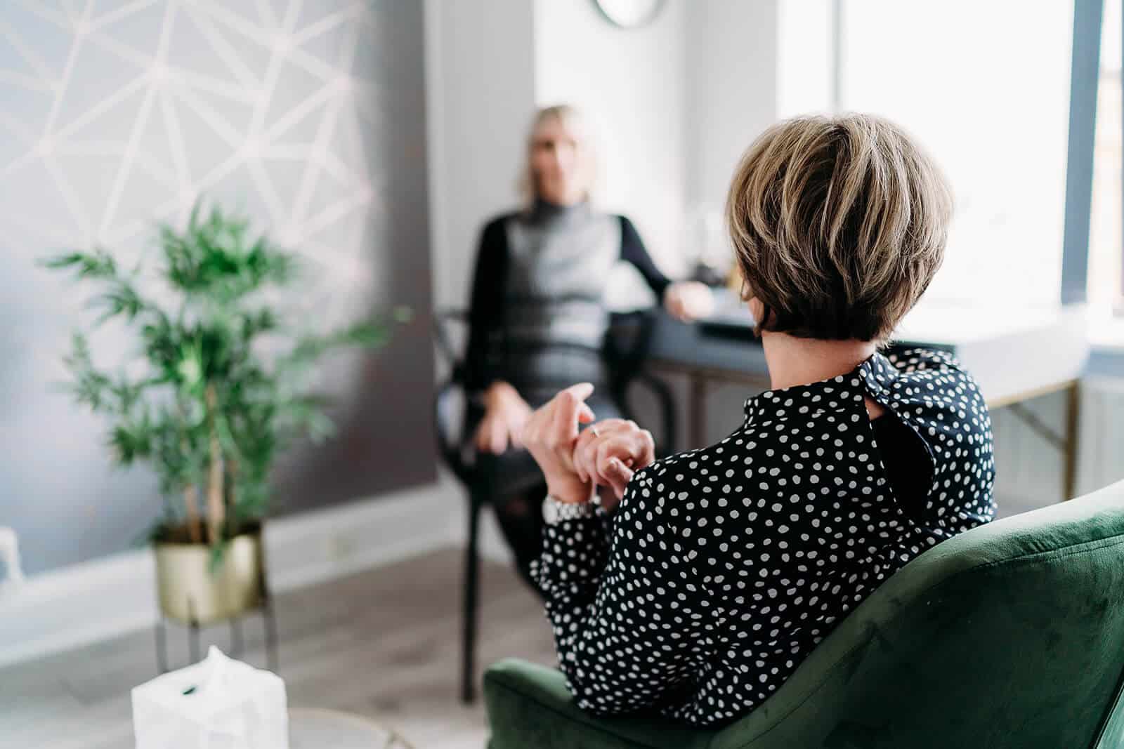 Jo speaking with lady with short bob haircut