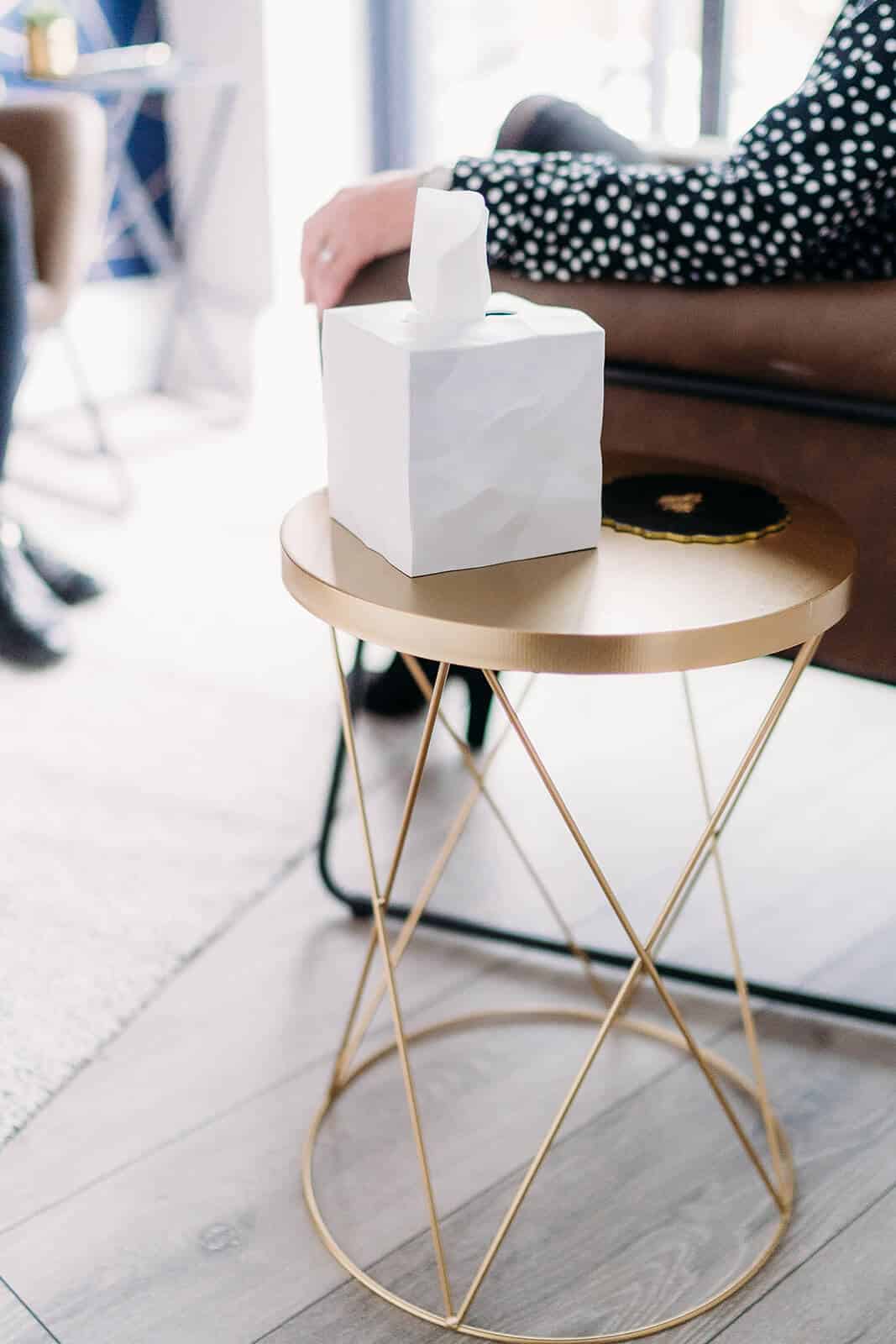 box of tissues on gold table